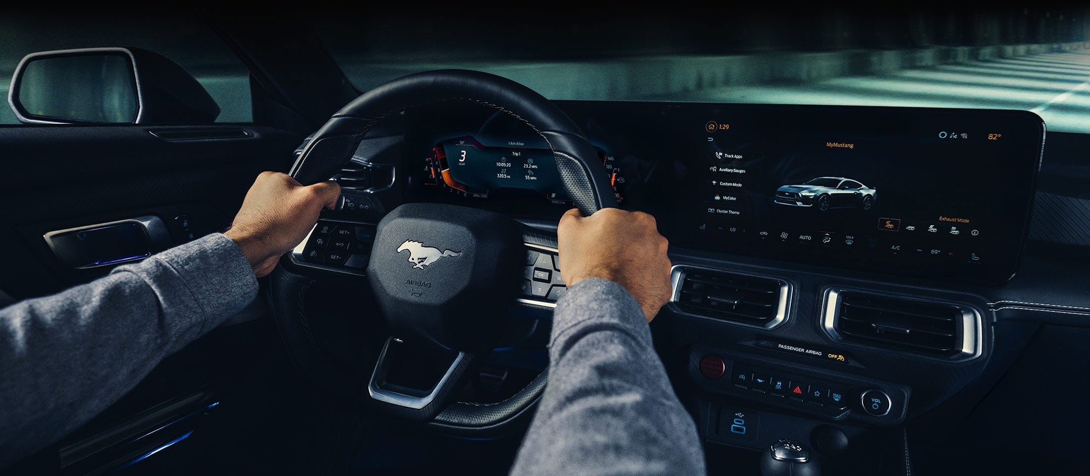 A 2024 Ford Mustang® model interior with a person driving | Griffin Ford Fort Atkinson in Fort Atkinson WI