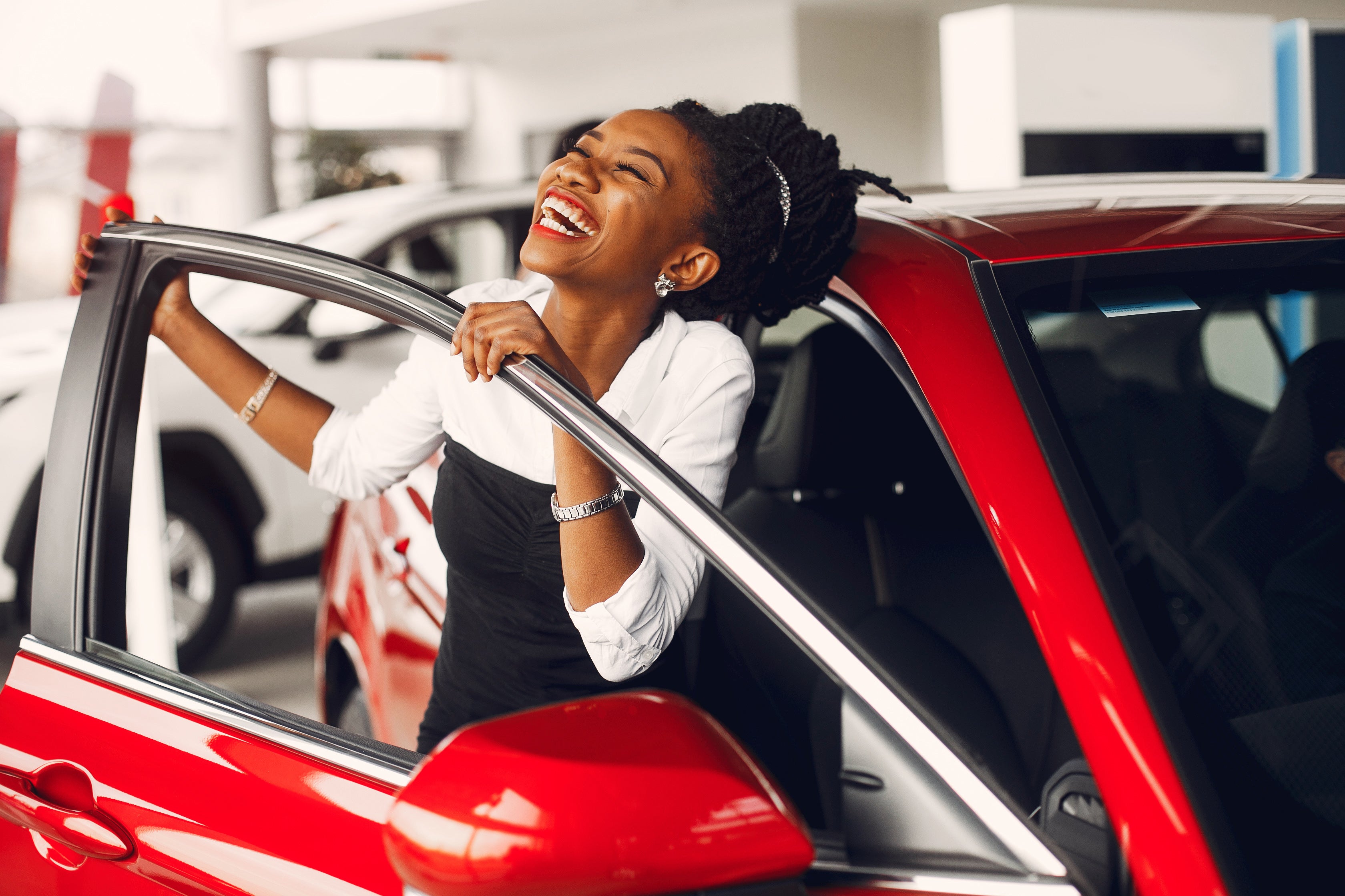 Woman happy purchasing a car