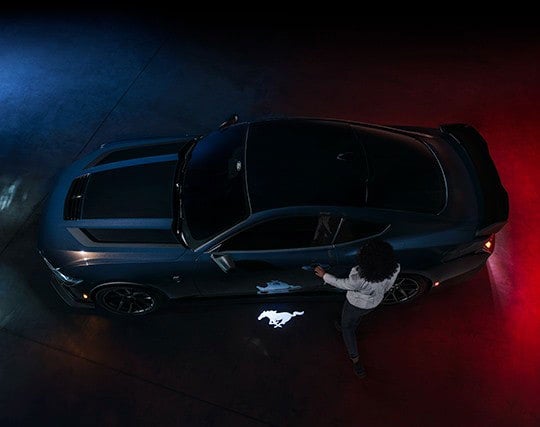 2024 Ford Mustang® Dark Horse™ model with a driver approaching the vehicle | Griffin Ford Fort Atkinson in Fort Atkinson WI