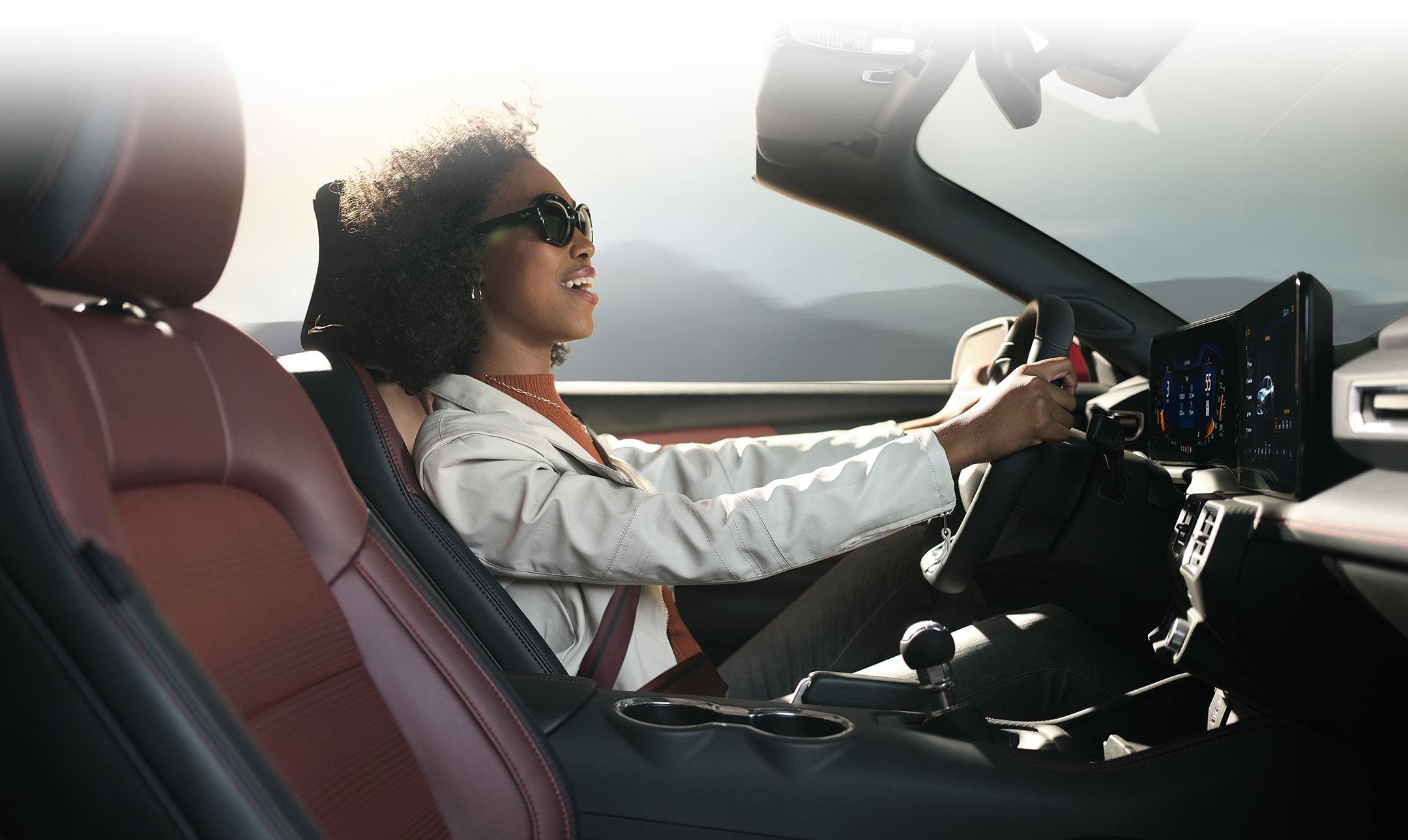 Person sitting in the driver’s seat of a 2024 Ford Mustang® convertible | Griffin Ford Fort Atkinson in Fort Atkinson WI
