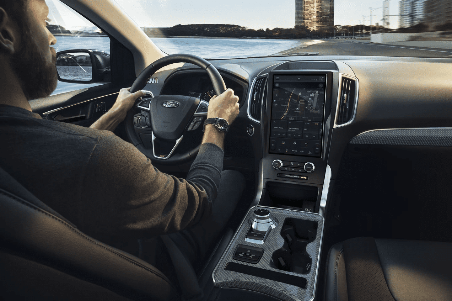 Man with cool watch drives a 2022 Ford Edge