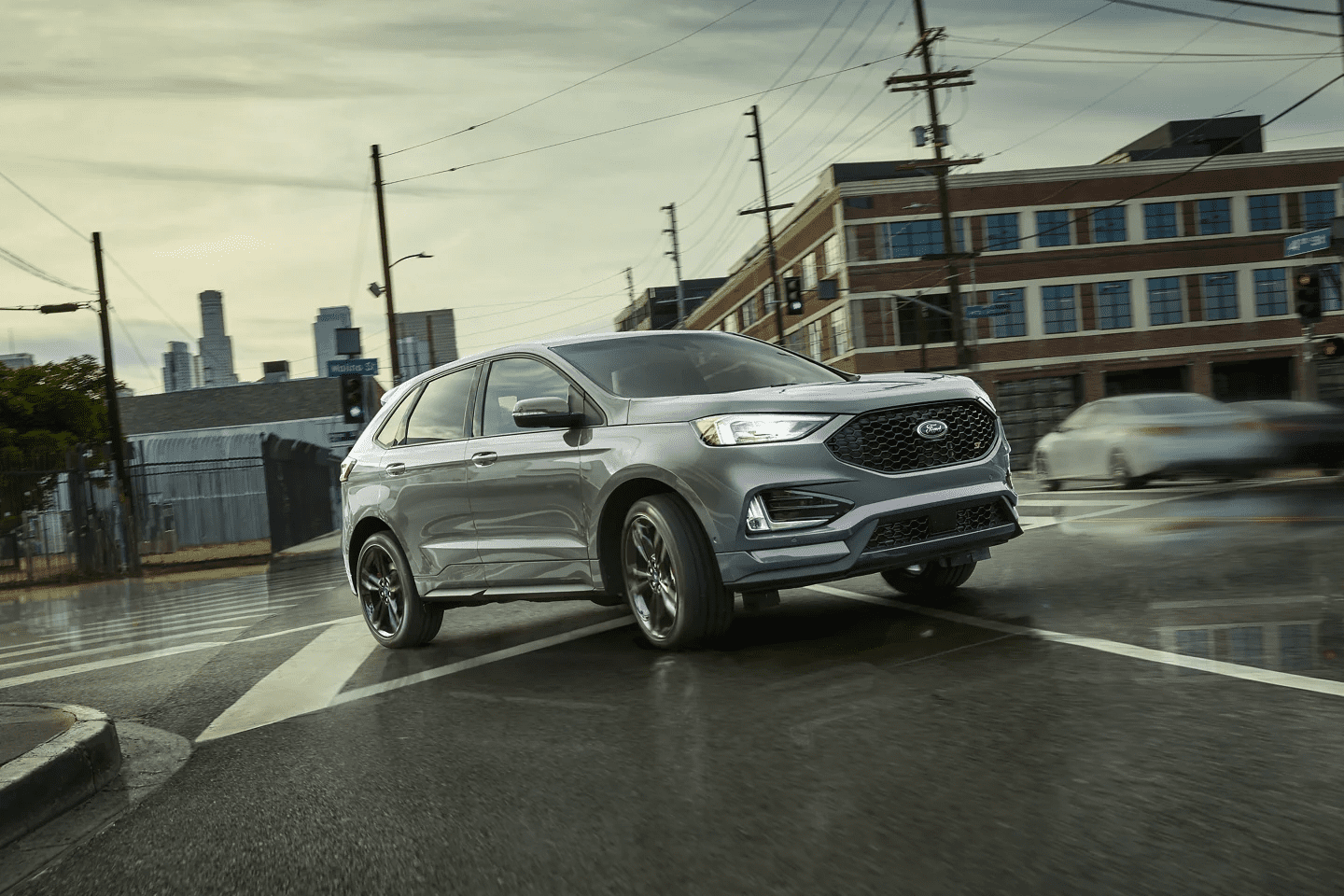 Silver 2022 Ford Edge shines on a dark road